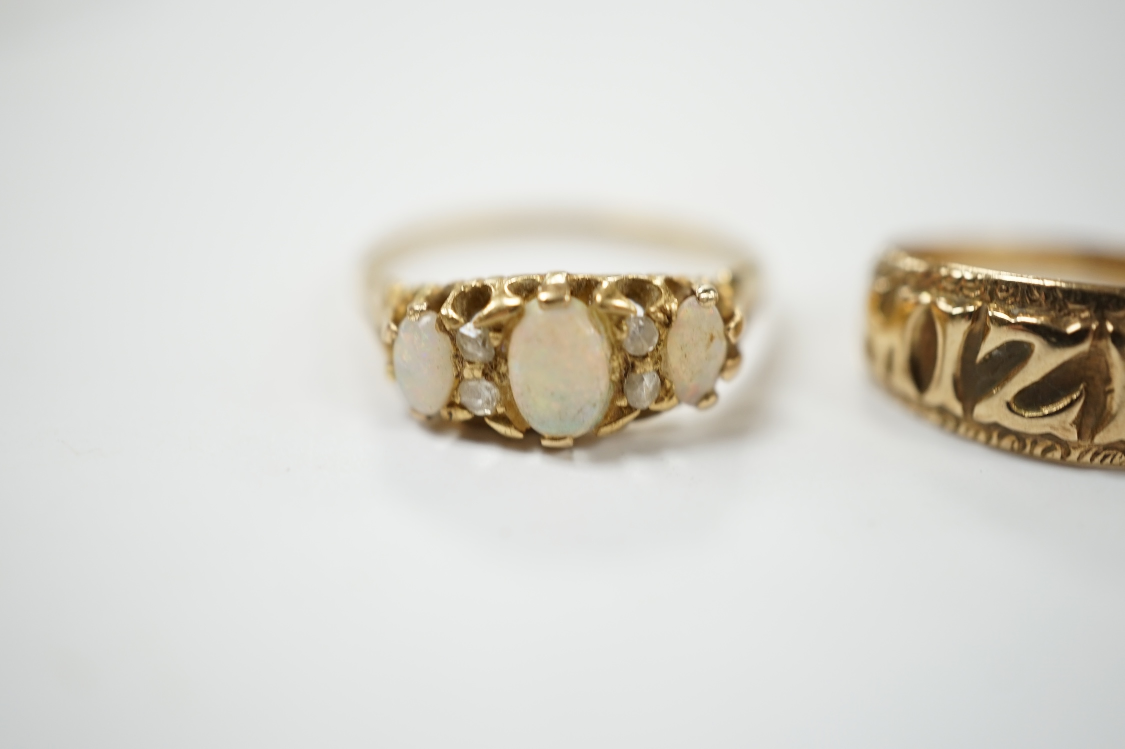 A 9ct gold 'Mizpah' ring and a yellow metal, three stone white opal set ring, with diamond chip spacers, size P, gross weight 5.2 grams. Condition - poor to fair